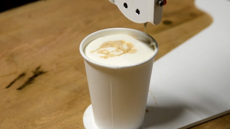 Illustration for article titled Barista Bot Paints Your Portrait On Your Latte